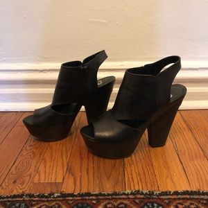 GB peep toe black leather platforms